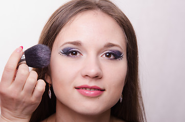 Image showing Beautiful girl powder applied to the face