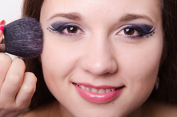Image showing Model is applied to the face powder