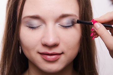 Image showing Makeup artist paint brush forever young girl