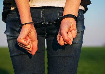 Image showing Woman with handcuffed hands