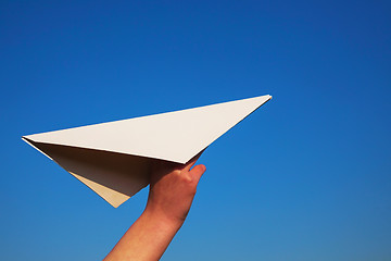 Image showing Hand holding paper plane