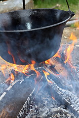 Image showing big cauldron on campfire