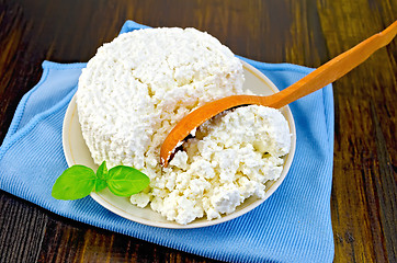 Image showing Curd with a wooden spoon on board