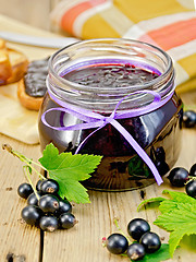Image showing Jam blackcurrant with a napkin on board