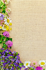 Image showing Frame of wild flowers on sackcloth 1