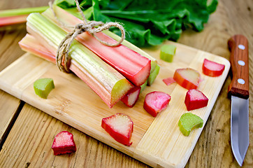 Image showing Rhubarb cut on board with knife