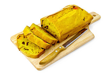 Image showing Fruitcake pumpkin with candied fruits on wooden board