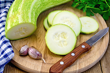 Image showing Zucchini green with napkin on board