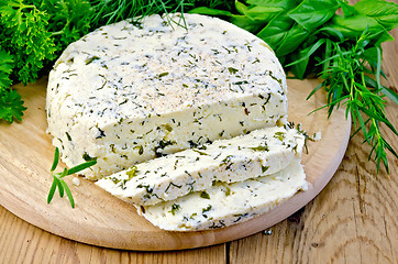 Image showing Cheese homemade round with spices on board