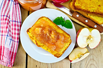 Image showing Bread with apple jam in plate on board