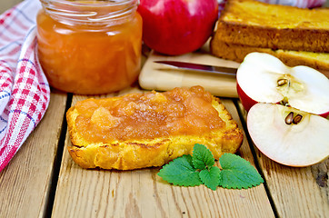 Image showing Bread with apple jam and apples on board