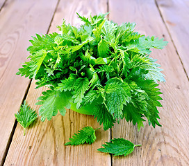 Image showing Nettles in a green bowl on board