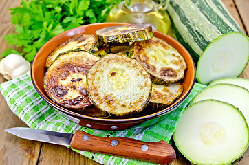 Image showing Zucchini fried with napkin on board