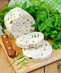 Image showing Cheese homemade with spices and napkin on board