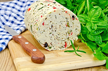 Image showing Cheese homemade with hot pepper and napkin on board