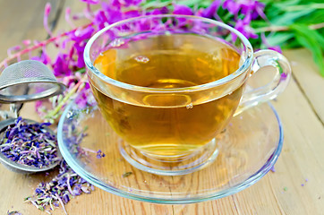 Image showing Herbal tea from fireweed in cup with strainer