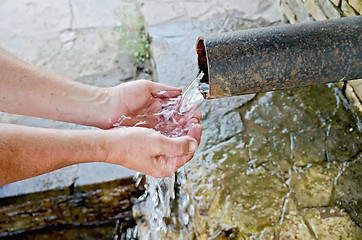 Image showing Water spring with hands