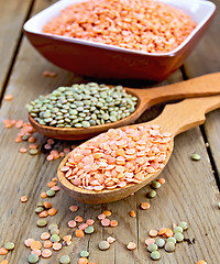 Image showing Lentils red and green in spoon with bowl on board