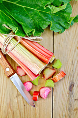 Image showing Rhubarb cut with leaf on a wooden board