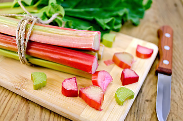 Image showing Rhubarb cut on board with sheet