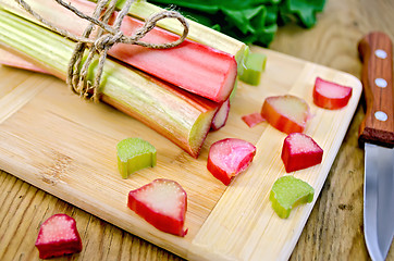 Image showing Rhubarb cut and knife on board