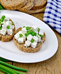 Image showing Bread with feta and chives on a plate