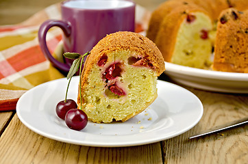 Image showing Cake with cherries and plate on board