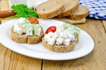 Image showing Bread with cheese and tomatoes in white plate