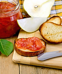 Image showing Bread with pear jam and leaf on board