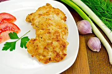 Image showing Fritters chicken with green onions on board