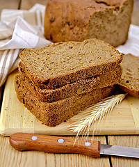 Image showing Rye homemade bread with spikelet on board