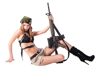 Image showing Pretty woman with sniper rifle on floor