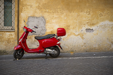 Image showing Bright shiny red Vespa scooter