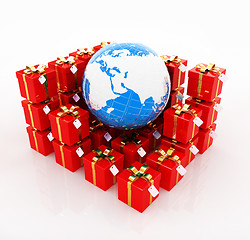 Image showing Traditional Christmas gifts and earth. Global holiday concept
