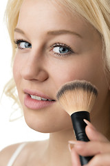 Image showing closeup makeup applying 