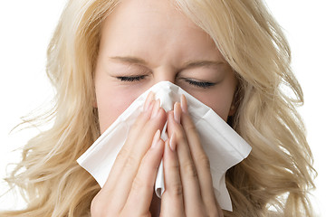 Image showing Ill woman with tissue is sneezing