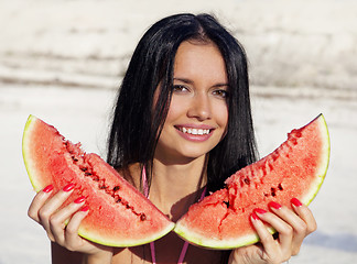 Image showing Beautiful girl eats water-melon