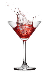 Image showing Red cocktail with splash isolated