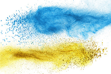 Image showing Blue and yellow powder explosion isolated