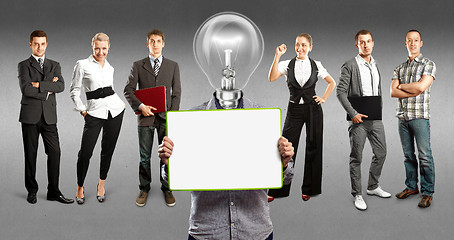 Image showing Business Team With Lamp Head