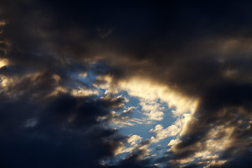 Image showing Storm clouds on sunset sky