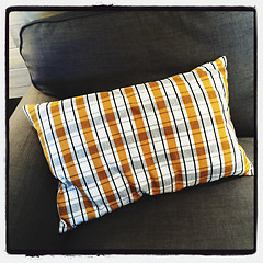 Image showing Gray sofa with checked cushion