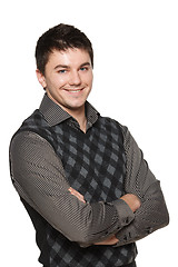 Image showing Portrait of young smiling confident man with folded hands