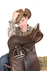 Image showing Horse rider tips his hat