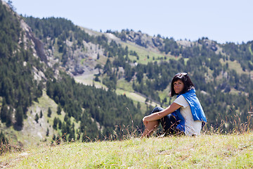 Image showing Woman relaxing in the mountain