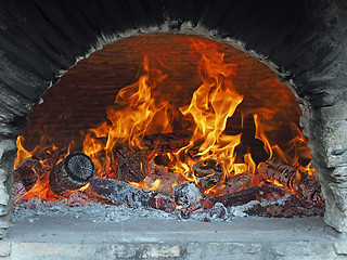 Image showing wood fire in a bread oven