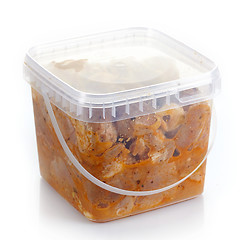 Image showing Marinated pork meat pieces in a plastic box