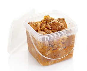 Image showing Marinated pork meat pieces in a plastic box
