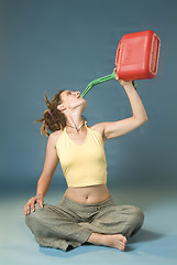 Image showing woman drinks of jerry can