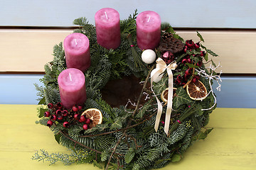 Image showing Christmas wreath with pink candles